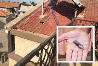  ?? (Courtesy) ?? A HOLE IS seen in the roof of a home in Sderot after it was hit by a machine-gun bullet (inset) fired from Gaza.