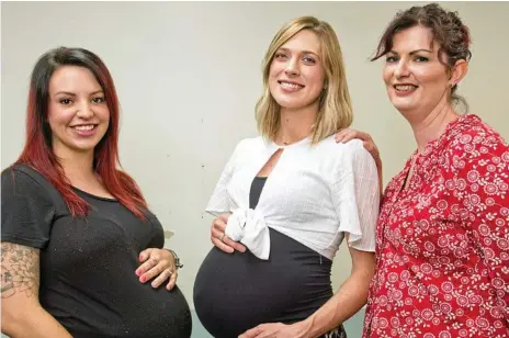  ?? Photo: Nev Madsen ?? EASY TREATMENT: Lauren Ramage (left) and Crystal Edwards (middle) feel better through their pregnancie­s after having their iron levels screened by midwife Haidee Latham at the Toowoomba Hospital.