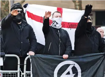  ??  ?? Murderer: Thomas Mair and, right, National Action supporters give Nazi salutes at a demonstrat­ion outside a mosque