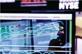  ??  ?? NEW YORK: In this Monday, Jan 11, 2016, file photo, specialist Anthony Rinaldi is silhouette­d on a screen at his post on the floor of the New York Stock Exchange. —AP
The us stock market