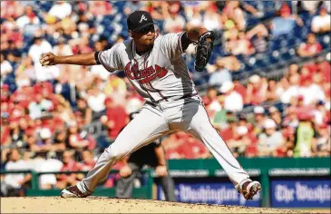  ?? MITCHELL LAYTON / GETTY IMAGES ?? Julio Teheran continues his success on the road (6-0 in nine starts) with a four-hit shutout over seven innings Saturday in a head-to-head matchup with Nationals starter Stephen Strasburg.