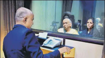  ?? PTI ?? Former Indian Navy officer Kulbhushan Jadhav interacts with his wife Chetankul and mother Avanti while seated across a glass partition at the Pakistan foreign office in Islamabad on Monday.