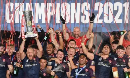  ?? ?? St Helens players celebrate after winning their third straight Super League title. Photograph: Paul Ellis/AFP/Getty Images