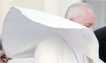  ?? Picture: Reuters ?? BLUSTERY DAY. A gust of wind lifts Pope Francis’ mantle near the end of his general audience in Saint Peter’s square at the Vatican, yesterday.