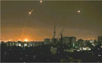  ?? — AFP photo ?? Three missile from the Iron Dome air defence system, designed to intercept and destroy incoming short-range rockets and artillery shells, from a position in the southern Israeli are seen from Gaza city.