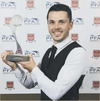  ??  ?? 0 Lewis Morgan, who spent the whole of last season at St Mirren but signed a contract with Celtic in January, poses with his PFA Scotland Championsh­ip Player of the Year award.