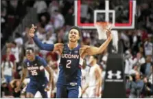  ?? CAL SPORT MEDIA VIA AP IMAGES ?? UConn’s Jalen Adams gestures to the crowd after hitting the gamewinnin­g shot against Temple on Sunday.