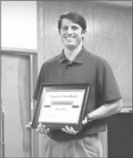  ??  ?? Teacher of the Month: During an El Dorado School Board meeting, Washington Middle School teacher Jarrod Hemund accepts a Teacher of the Month award.