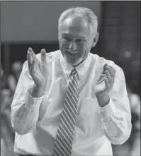  ?? Arkansas Democrat-Gazette/Mitchell Pe Masilun ?? PERFECT ENDING: Guy-Perkins’ head coach John Hutchcraft celebrates after his team took a five-point lead late in the fourth quarter during the Class 1A boys’ state championsh­ip game Saturday at Bank of the Ozarks Arena. Hutchcraft closed his 42-year...