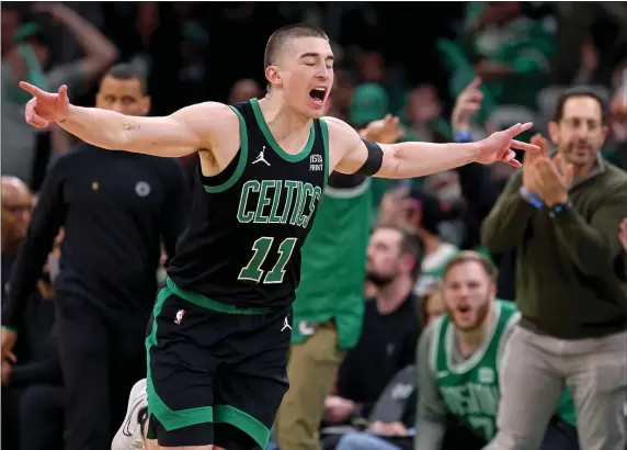  ?? MATT STONE — BOSTON HERALD ?? Celtics guard Payton Pritchard celebrates his 3-pointer during the first half of Boston’s win over the Bucks at the TD Garden.