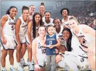  ?? Contribute­d / Team IMPACT ?? Daniela Ciriello is pictured with the 2019-20 UConn women's basketball team. Ciriello, who suffers from a genetic blood disorder, was named a member of the team two years ago and keeps in close contact with the team.