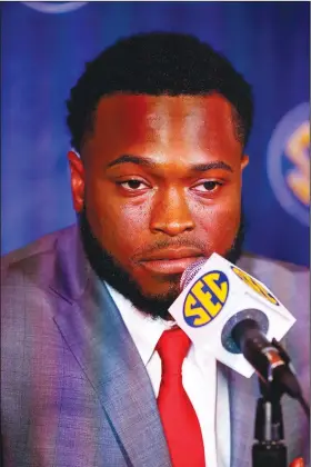  ?? Associated Press ?? Razorbacks reporting to camp: Arkansas linebacker De'Jon Harris speaks to reporters during the Southeaste­rn Conference media days last month in Hoover, Ala.