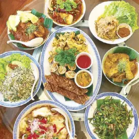  ??  ?? The vibrant colors but even more vibrant and bright flavors of the Nyonya table