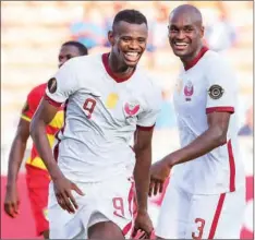  ??  ?? Qatar’s Mohammed Muntari (left) and Abdelkarim Hassan are all smiles after the former scored the side’s third goal.