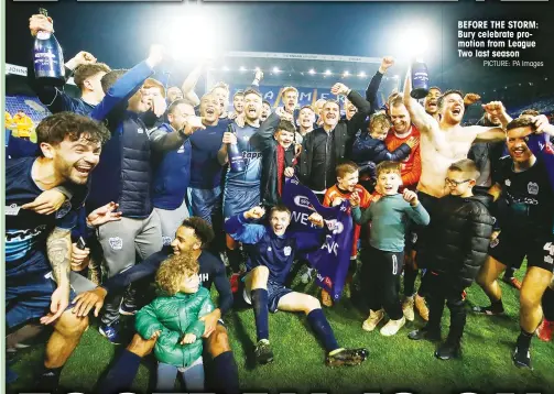  ?? PICTURE: PA Images ?? BEFORE THE STORM: Bury celebrate promotion from League Two last season