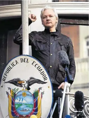  ??  ?? DEFIANT: Julian Assange speaks from the balcony of the Ecuadorian embassy