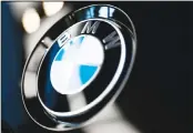  ??  ?? This file photo shows the logo of German car
manufactur­er BMW pictured on a BMW car prior to the earnings press
conference in Munich, Germany.
The company’s net profit fell 29%
to 1.48 billion euros ($1.63 billion) in the second
quarter from a year earlier. (AP)