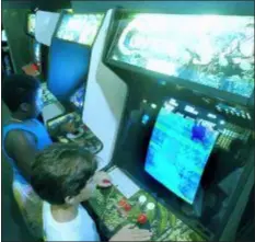  ?? JOE SKIPPER — THE ASSOCIATED PRESS FILE ?? In this file photo, Carlos Tunnerman, 10, plays the “Contra” video game at an arcade in a Miami, Fla. Decades of study have failed to validate the most prevalent fear, that violent games encourage violent behavior.