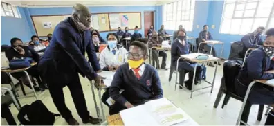  ?? / Sino Majangaza ?? Eastern Cape education MEC Fundile Gade visits grade 12 pupils as they sit for their exam last year, just before writing a question paper in their mother tongue.