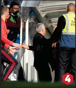  ??  ?? 4 DON’T GO THERE: Mourinho finds his way blocked at the tunnel entrance as players and staff from United’s bench move in to help