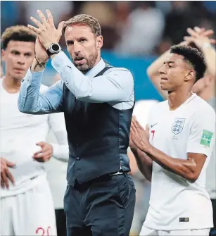  ?? REBECCA BLACKWELL THE ASSOCIATED PRESS ?? England head coach Gareth Southgate walks the field after his team lost in the World Cup semifinal to Croatia in Moscow on Wednesday.