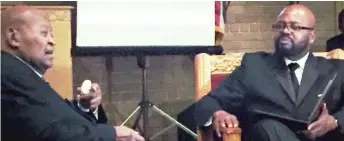  ?? PROVIDED PHOTO ?? John Fountain interviewi­ng his grandfathe­r George Hagler in 2017 at the True Vine Church of God in Bellwood, which Hagler founded in 1973.