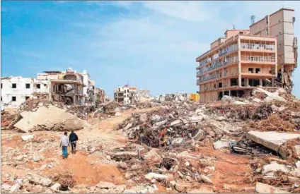  ?? Photo: Abdullah Mohammed Bonja/getty Images & Afp/getty Images ?? Destructio­n: Flash floods caused death as they destroyed buildings in the city of Derna in eastern Libya.