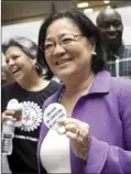  ?? AP photo ?? Sen. Mazie Hirono, DHawaii, a member of the Senate Judiciary Committee, is welcomed by protesters opposed to President Donald Trump’s Supreme Court nominee, Brett Kavanaugh, as they demonstrat­e in the Hart Senate Office Building on Capitol Hill in Washington on Thursday.