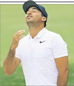  ?? Getty Images ?? IN THE HUNT: Jason Day reacts to his second shot on the 18th hole on Friday. Unlike all his other appearance­s in the Memorial, Day is in contention at 8-under and three shots off the lead.