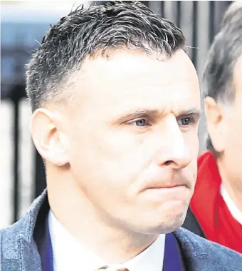  ?? PHOTO: COLLINS COURTS ?? Detective Garda Brian Dunne leaves the Four Courts yesterday after he was awarded €38,500 damages following a High Court Garda compensati­on hearing.
