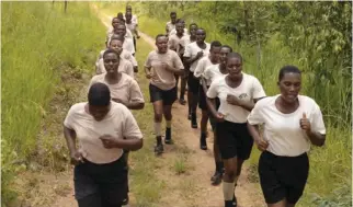  ?? ?? Akashinga rangers on a training run at their camp in Phundundu Wildlife Park in Hurungwe