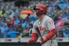  ?? MARK LENNIHAN — THE ASSOCIATED PRESS ?? Outfielder Rhys Hoskins was one of the only two homegrown players in the starting lineup for the Phillies Sunday. He hit a two-run homer in the 6-4 loss to the Mets at Citi Field.