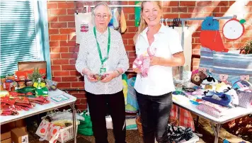  ?? ?? Customer Julie Dennert (right) from Cowes, with the help of Drouin CWA member Joan Blaby found some things she liked at the CWA stall on Thursday.