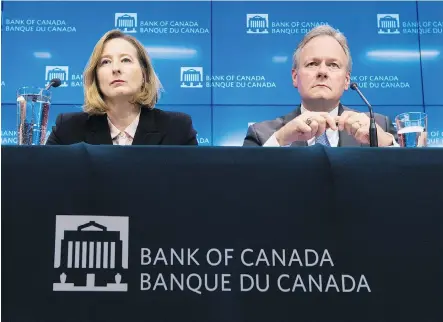  ?? ADRIAN WYLD/THE CANADIAN PRESS ?? A major reason that the Bank of Canada — led by governor Stephen Poloz and senior deputy governor Carolyn Wilkins — is unlikely to continue raising rates is the uncertaint­y stoked by U.S. President Donald Trump’s threats to end NAFTA, writes Kevin...