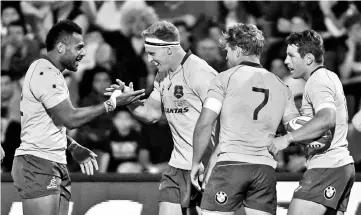  ??  ?? Australia’s Wallabies Reece Hodge (2-L) celebrates with teammates after scoring a try against Argentina’s Los Pumas during the Rugby Championsh­ip 2017 test match at Malvinas Argentinas stadium in Mendoza, some 1050 km west of Buenos Aires, Argentina on...