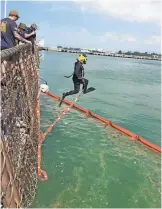  ?? MASTER CHIEF JOSHUA DUMKE, U.S. NAVY ?? Sea conditions and poor visibility made recovery efforts difficult for divers Wednesday.