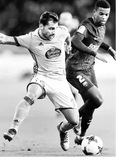  ??  ?? Celta Vigo’s Jonny Castro (left) vies with Barcelona’s Nelson Semedo during the Spanish Copa del Rey (King’s Cup) match at the Balaidos stadium in Vigo. — AFP photo