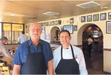  ?? STEVE SINOVIC/JOURNAL ?? Gary Hines, left, and food consultant Greg DesMaris take a break from launching the new biscuit eatery.