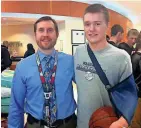  ?? MARK STEWART / MILWAUKEE JOURNAL SENTINEL ?? Joshua Kovach (left), a pediatric cardiologi­st, helped Michael Saxby at Children’s Hospital.