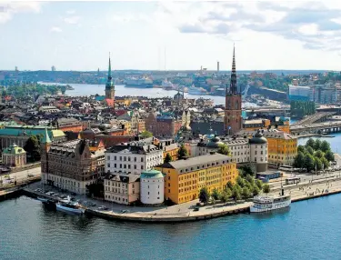  ?? Cameron Hewitt ?? Stockholm’s Riddarholm­en district — viewed here from City Hall — can be toured easily by bike.