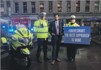  ??  ?? Chief Inspector Darren Faulds, Police Scotland’s Road Policing West Area Commander; Justice Secretary Humza Yousaf; and Superinten­dent Louise Blakelock, Police Scotland’s deputy head of road policing.