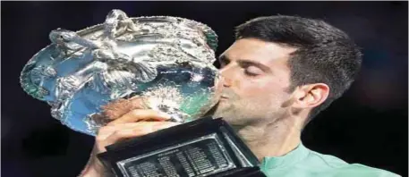  ??  ?? Novak Djokovic won the 2021 Australian Open yesterday to extend his record to nine titles Down Under and 18 Grand Slam overall