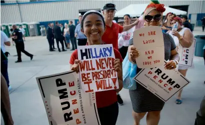  ?? AFP ?? Donald Trump supporters wait for him to arrive for a rally at a Florida airport in Melbourne, Florida, a day after his first debate with Hillary Clinton. —