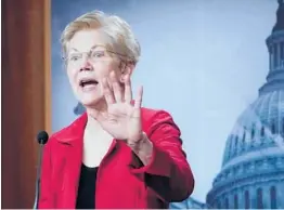  ?? SUSAN WALSH/AP ?? Sen. Elizabeth Warren, D-Mass., unveils the Ultra-Millionair­e Tax Act, a proposal that calls for hiking taxes on the ultrawealt­hy, last month in Washington.