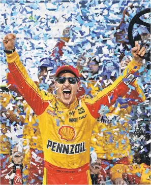  ?? PETER CASEY/USA TODAY SPORTS ?? Joey Logano celebrates winning the First Data 500 Sunday at Martinsvil­le Speedway.