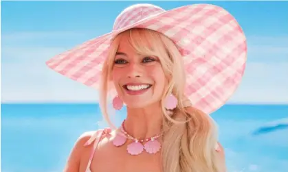  ?? Photograph: Landmark Media/Alamy ?? Margot Robbie in a scene from Barbie, which has joined the billion-dollar movie club. In modern box office history, just 53 films have made over $1bn.