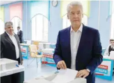  ?? — Reuters ?? Moscow’s Mayor Sergei Sobyanin casts his ballot during mayor election at a polling station in Moscow on Sunday.