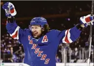  ?? Adam Hunger / Associated Press ?? The Rangers’ Artemi Panarin celebrates after a goal by Adam Fox against the Penguins during Game 1 on Tuesday.