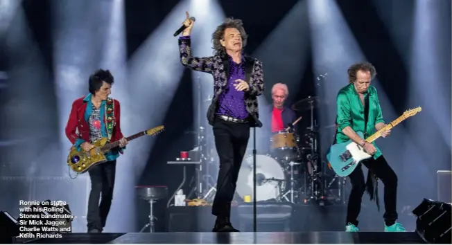  ??  ?? Ronnie on stage with his Rolling Stones bandmates Sir Mick Jagger, Charlie Watts and Keith Richards