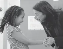  ?? JEAN LEVAC/OTTAWA CITIZEN ?? United Way Campaign co-chair Yaprak Baltacıogl­u shakes the hand of Jemma at the Overbrook Community Centre Wednesday. The eight-year-old participat­ed in a special mentorship program thanks to Big Brothers Big Sisters Ottawa and the United Way.